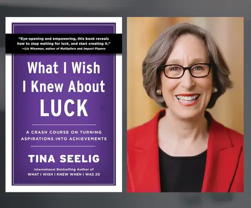 Woman in red blazer with glasses smiling and purple book cover