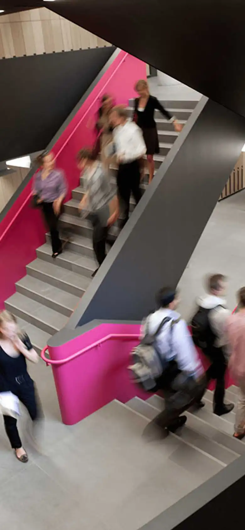 a group of students going down a staircase