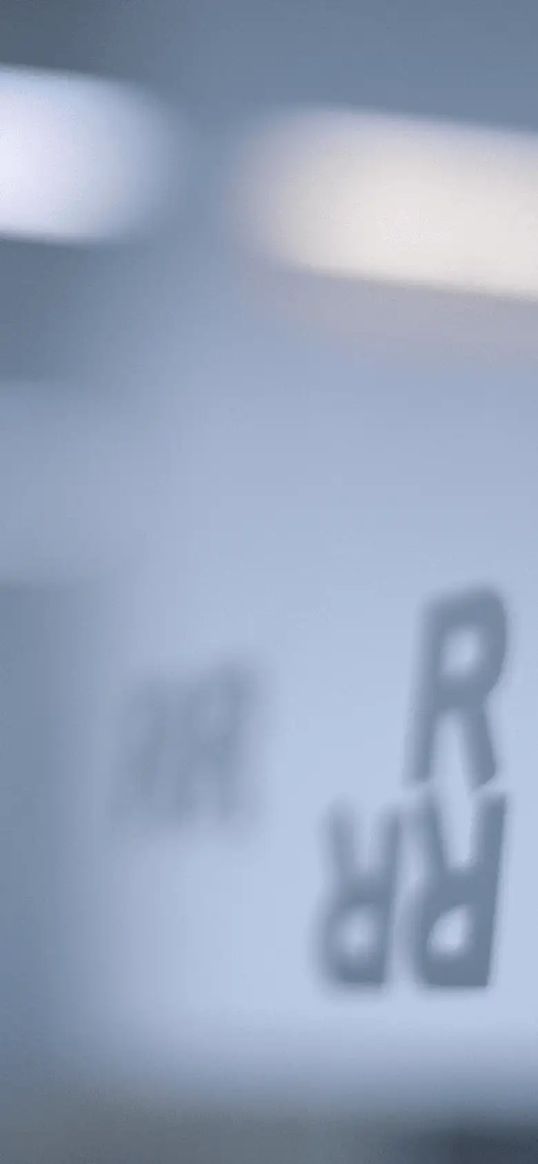 Rotman Rs depicted on a glass wall