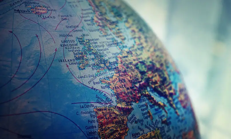 close-up of a globe focused on Italy