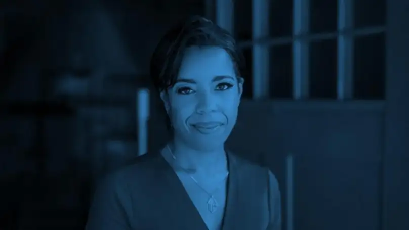 A headshot of Muriel Wilkins overlaid in blue