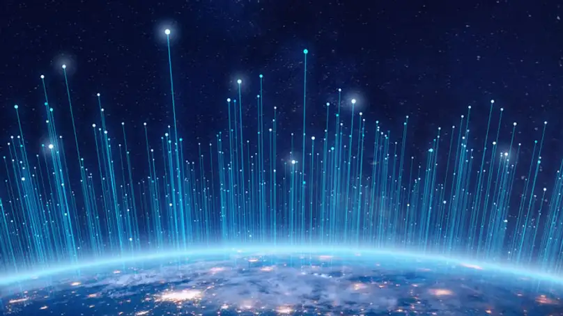 the world from space with lights cascading up from different points on the globe.